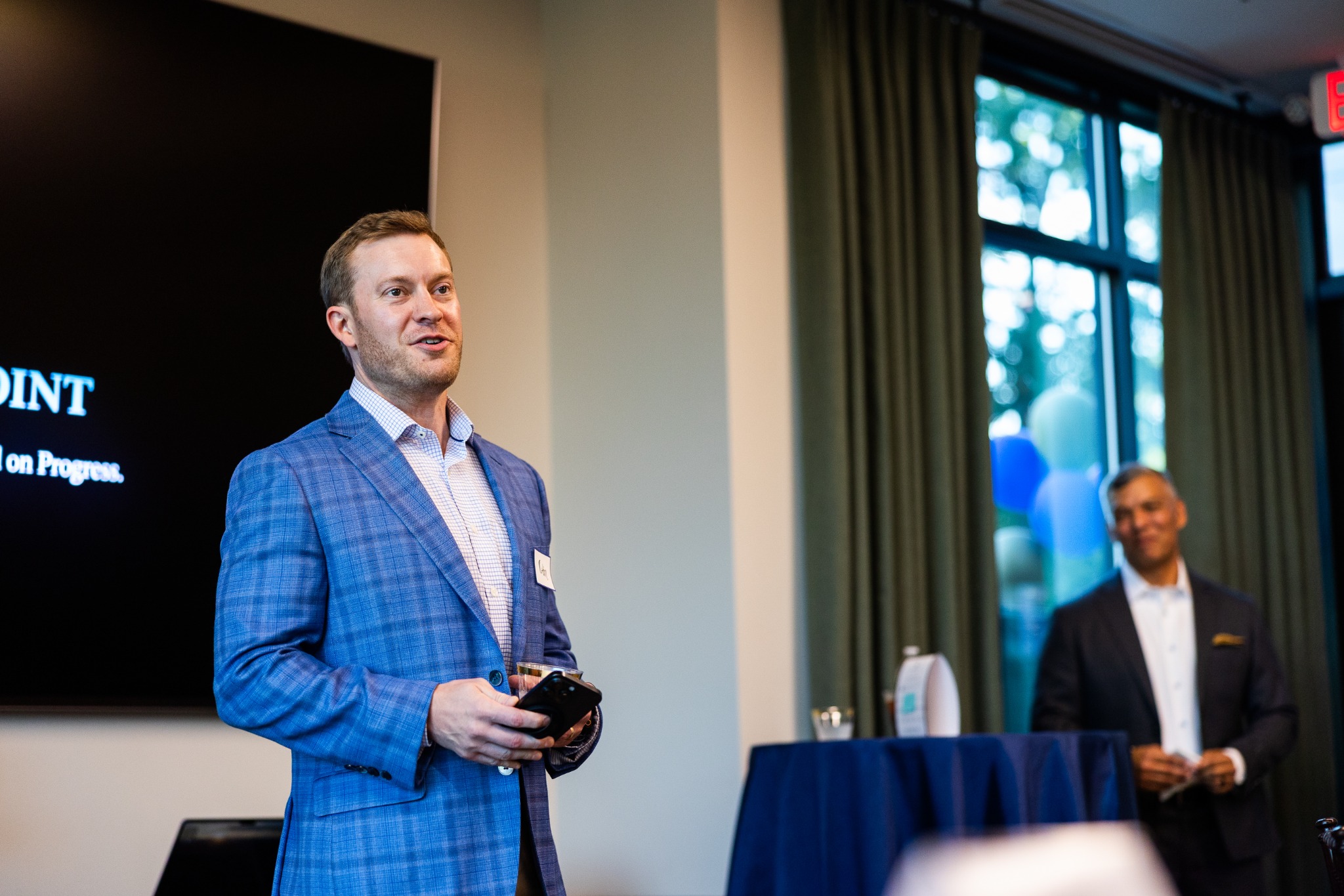 Colin Medlock wearing a blue blazer at an event